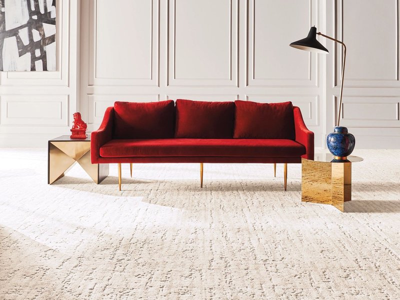 Red sofa on the carpet from Family Floors Furniture in Brandon, SD